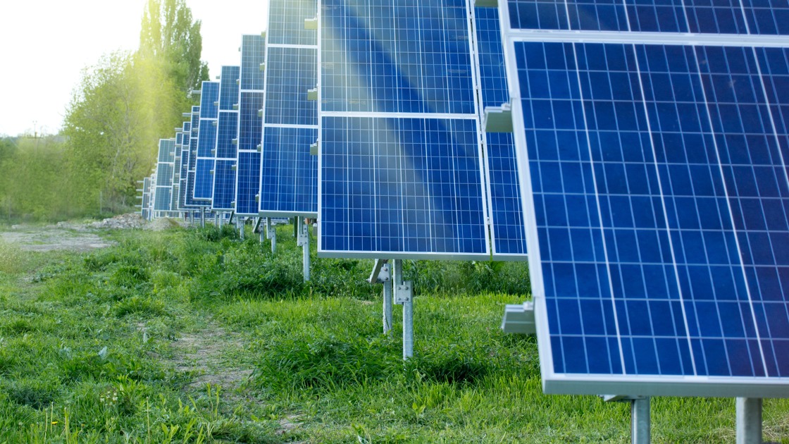 Solar energy panels against sunny sky